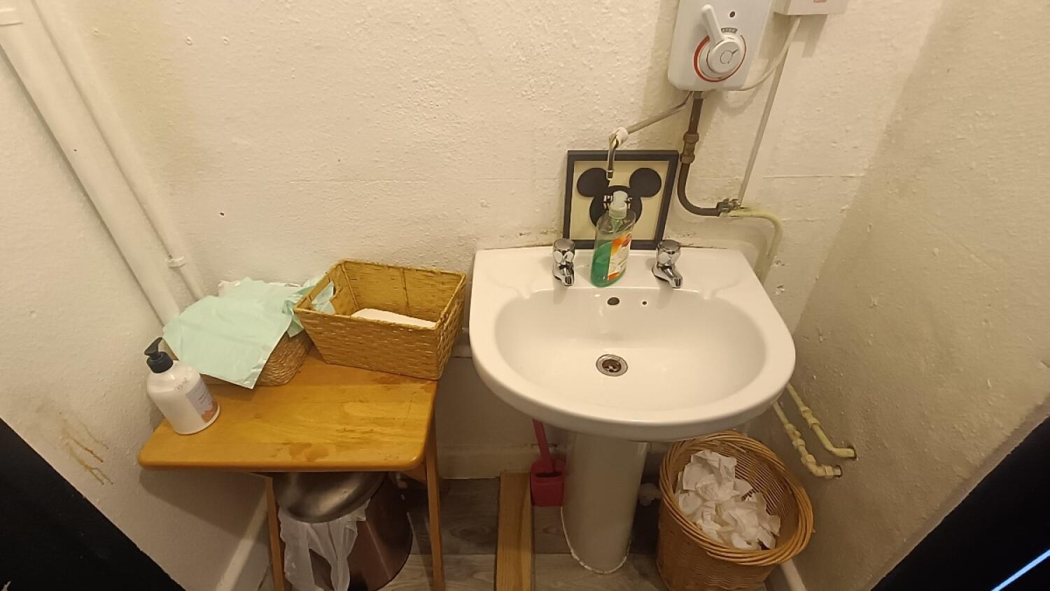 From common door facing left. Sink at back right.