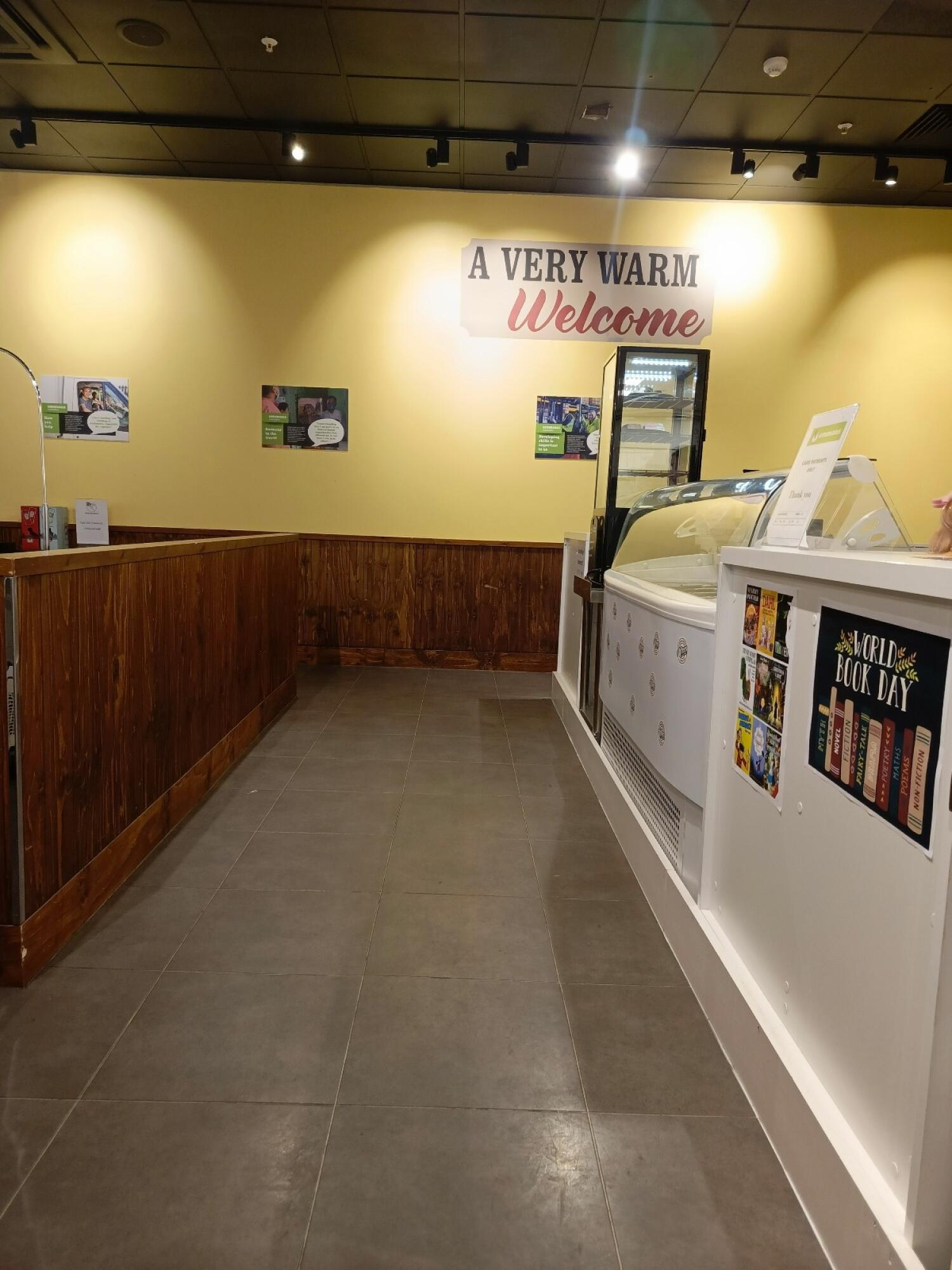 From end of wooden partition facing left. Wooden partition along left. Counter along right.