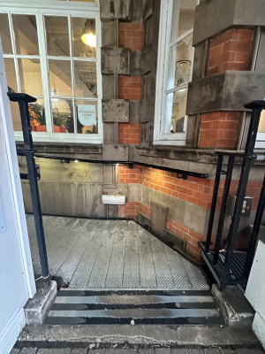 Built in ramp at foot with continued pathway at left