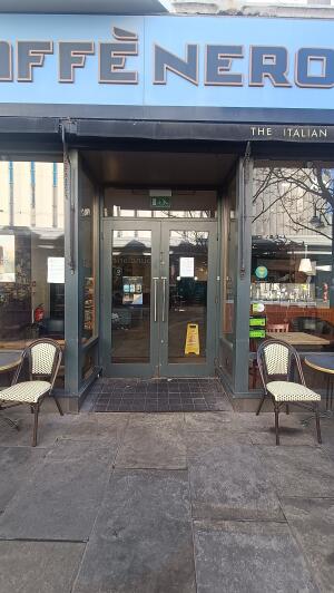 Dark metal-framed archway to venue.