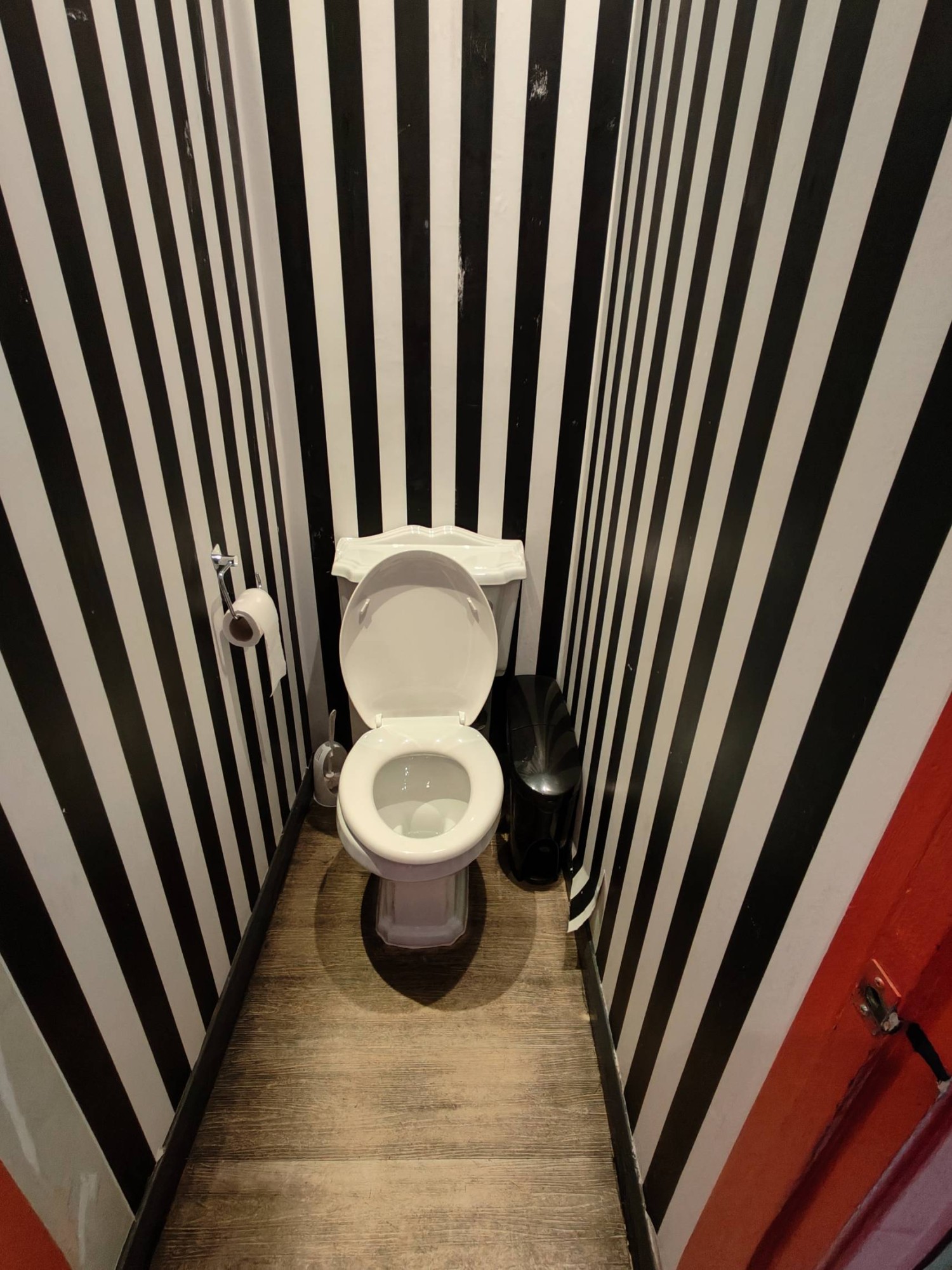 From door facing straight. Toilet at back.