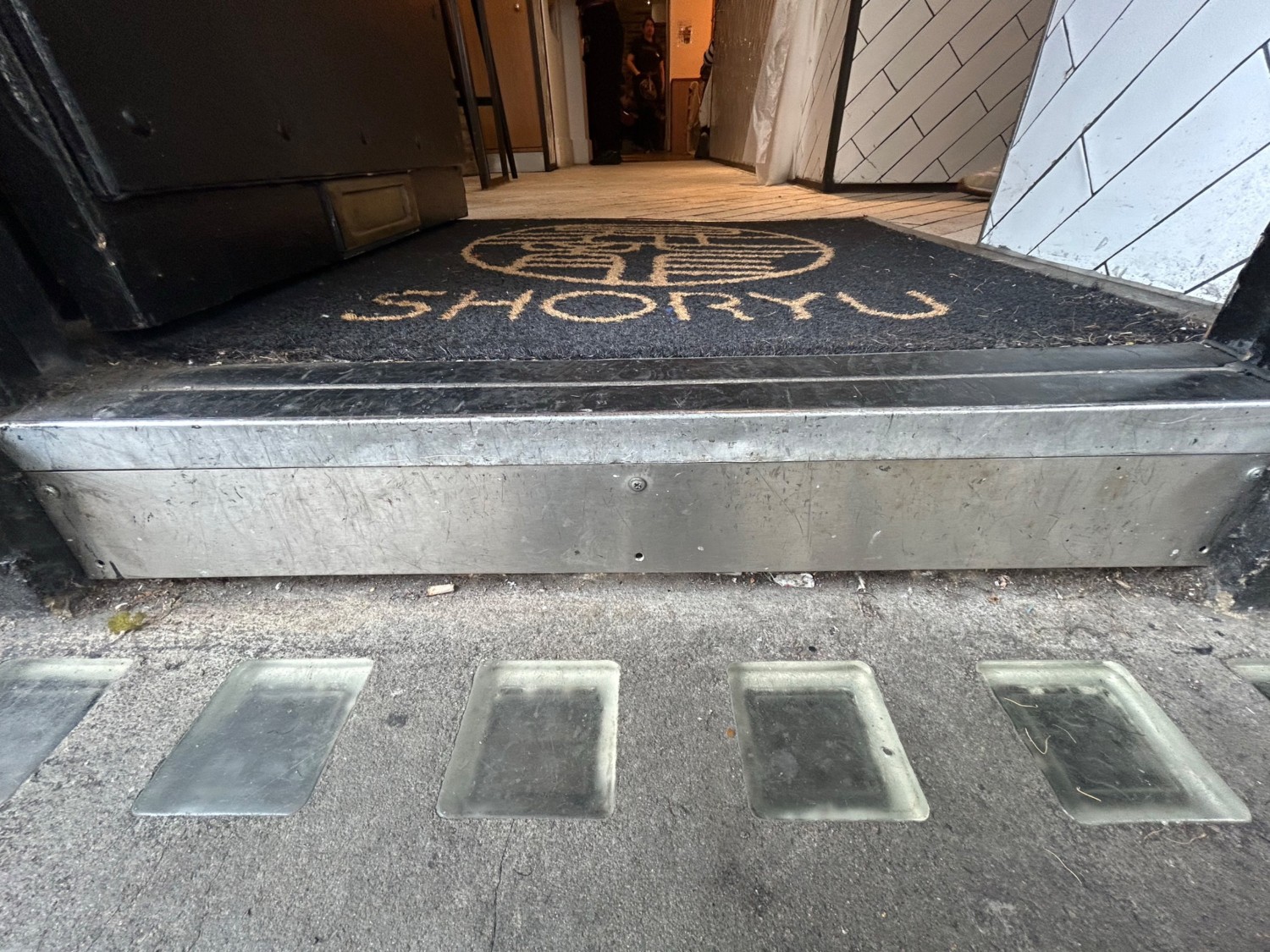 Step at foot of door.