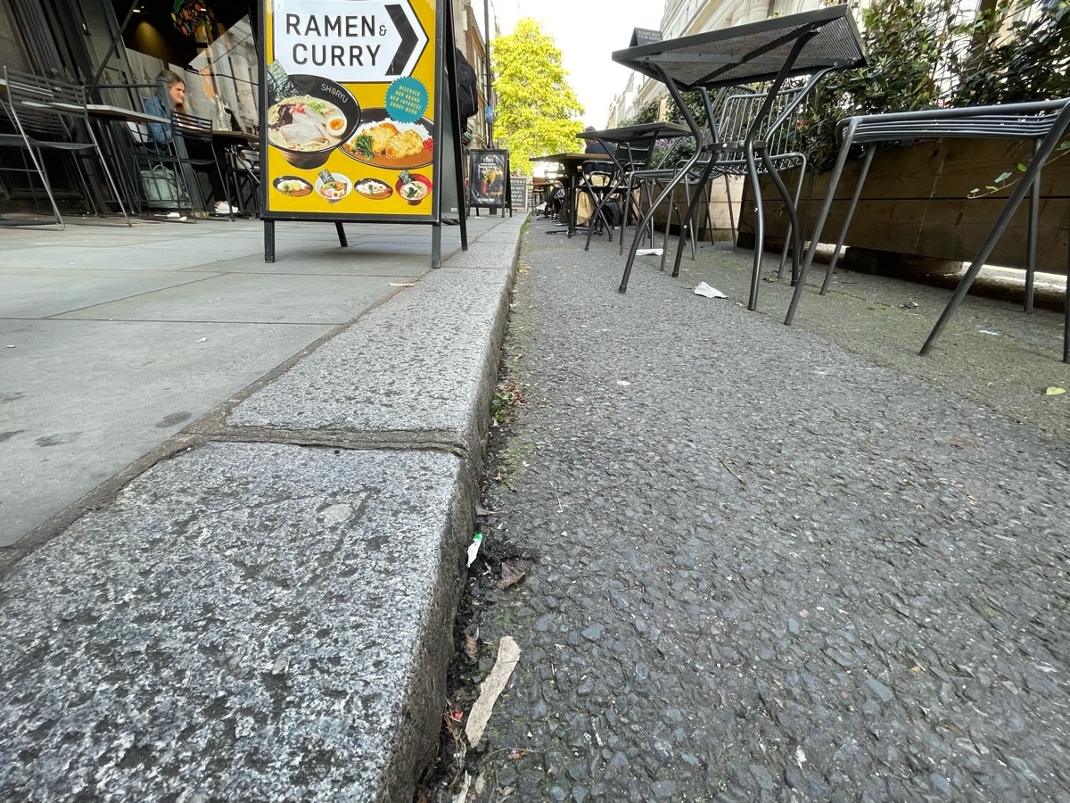 One step down from pavement to road.