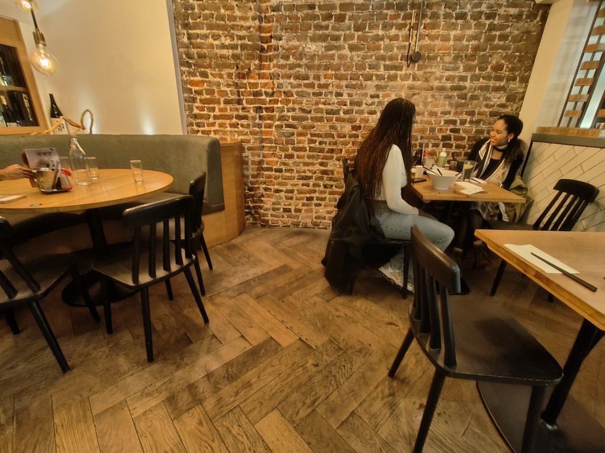 From tables and chairs on left facing right. Tables and chairs on right. Half booth at back left.