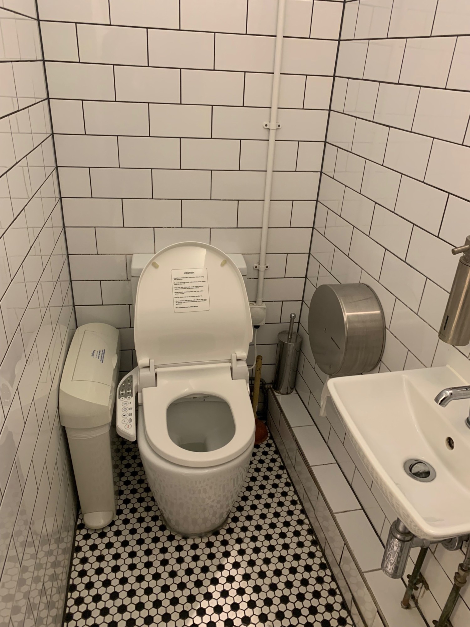 From toilet doorway, looking left. Sink on right wall. Toilet on back wall.