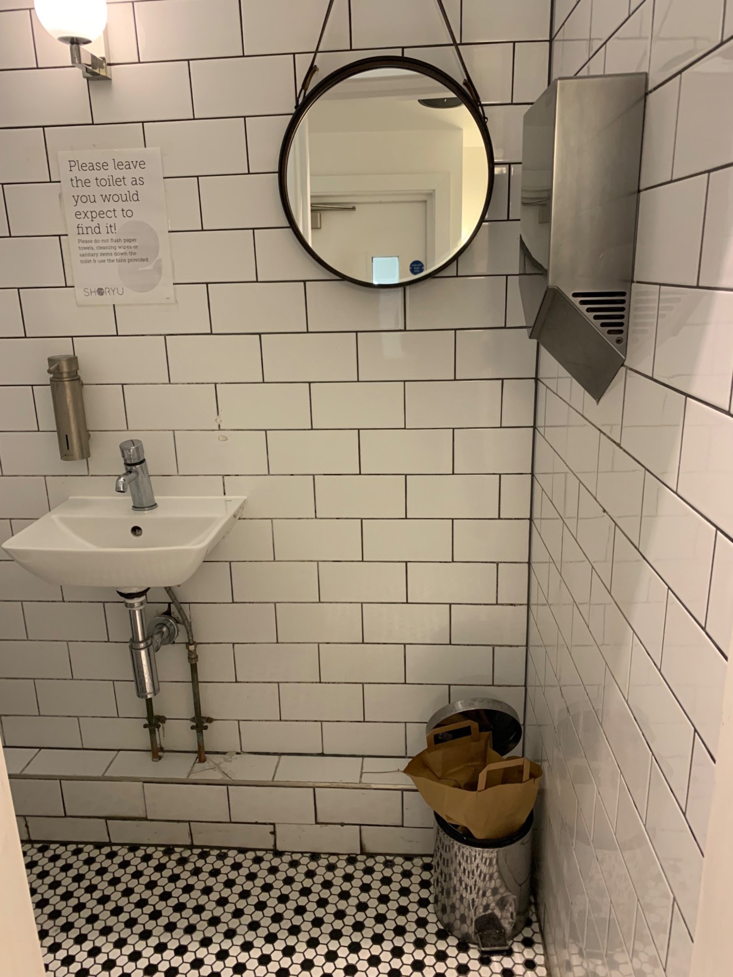 From toilet doorway, looking straight. Sink on left of back wall.