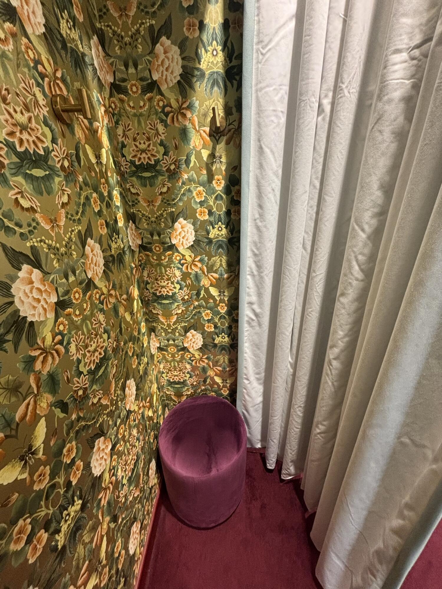 From curtain entrance facing right. Stool ahead. Curtain along right.
