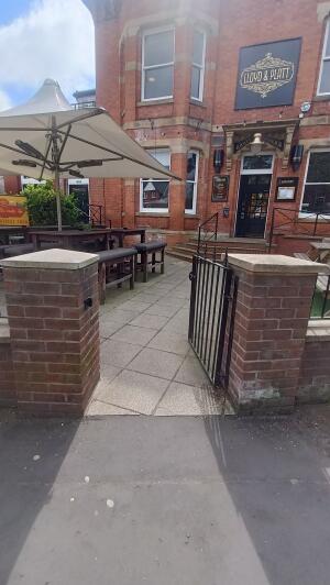 Metal door to venue. Push on left to open.