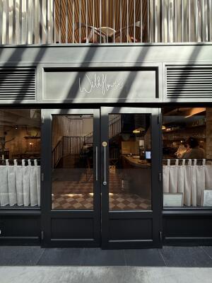 Black metal-framed glass doors. Use handles to open.