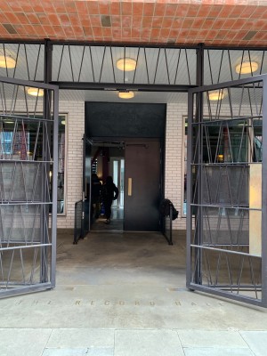 Double metal doors ahead. Pull from centre to open. Pathway following to second door.