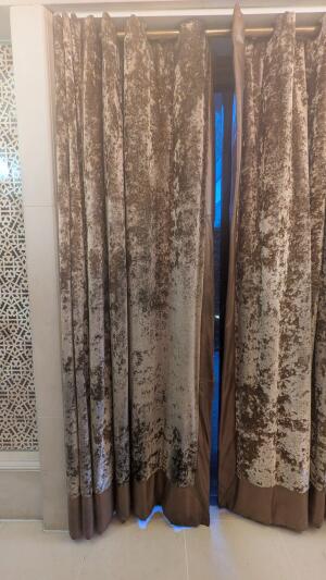 Doorway with curtain ahead. Slide curtains to both sides to open.