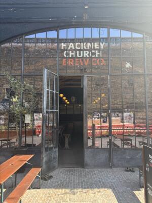 Black metal-framed glass doors. Doorway is open.