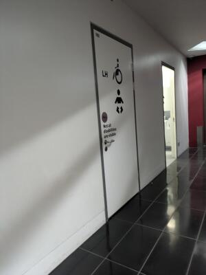 White door. Use handle to open.