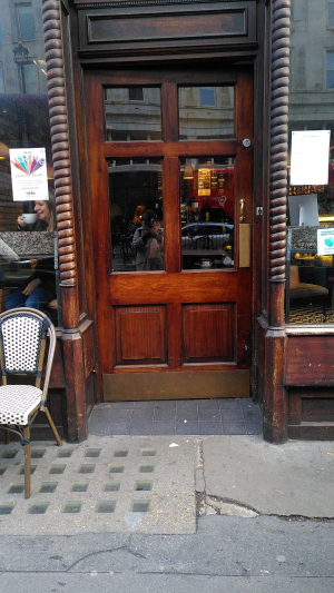Single door with handle on the right. Push to open.
