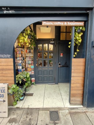 Archway ahead to entrance door at back.