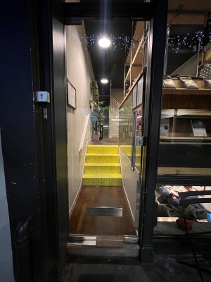 Glass door. Push from right.