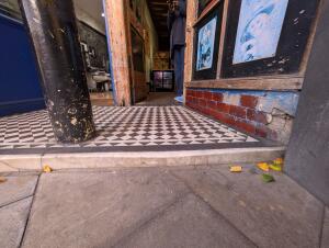 Step at archway before doorway.