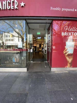 Glass door ahead. Pull from metal handle on left to open.
