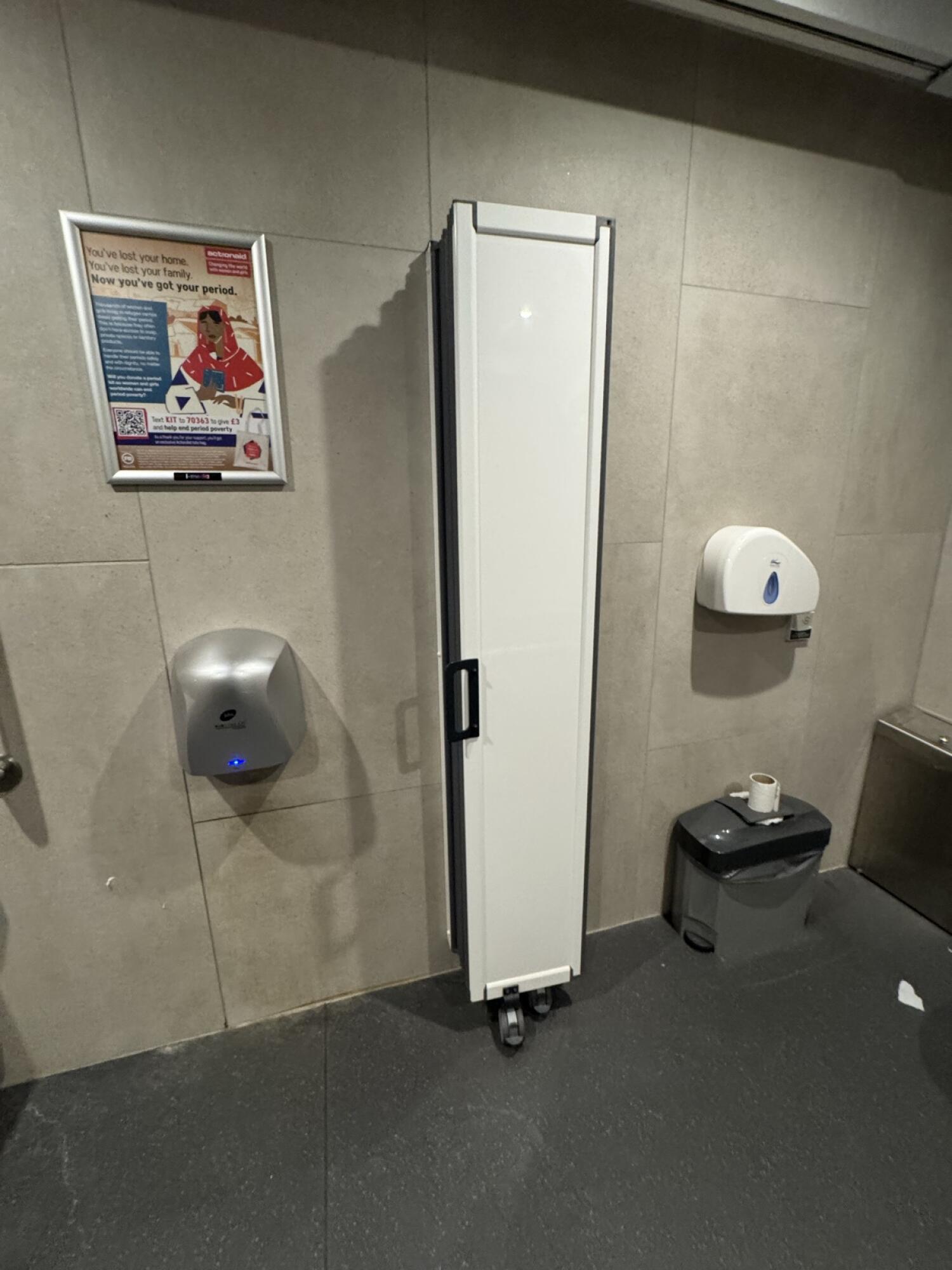 Baby changing station in centre. Toilet on right.