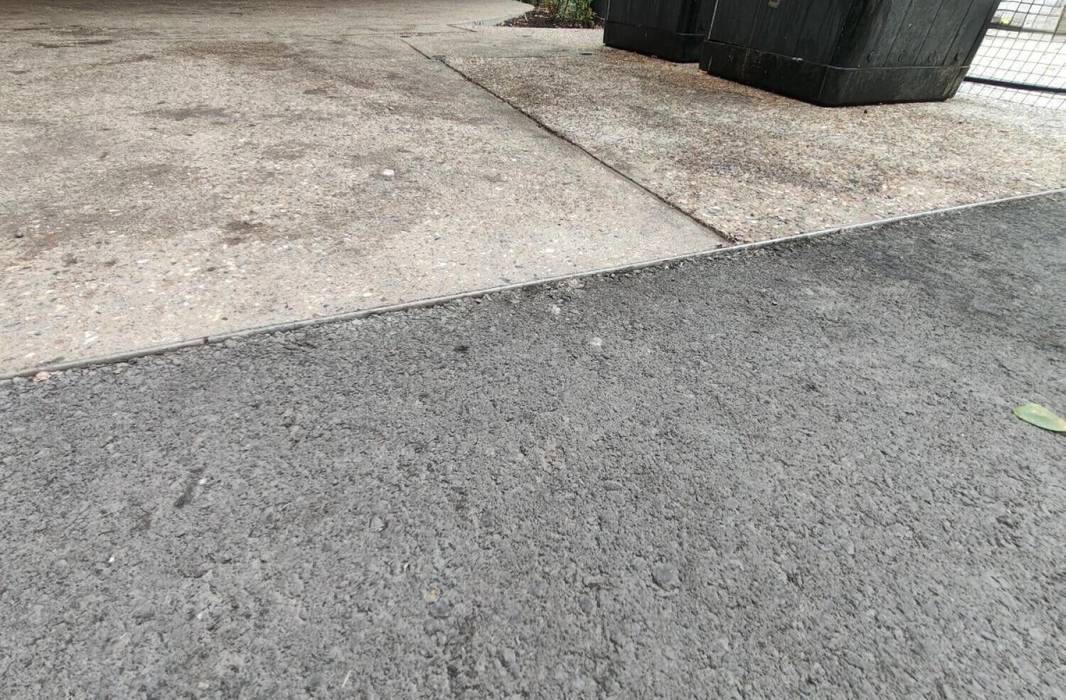 Small bump between asphalt and concrete.