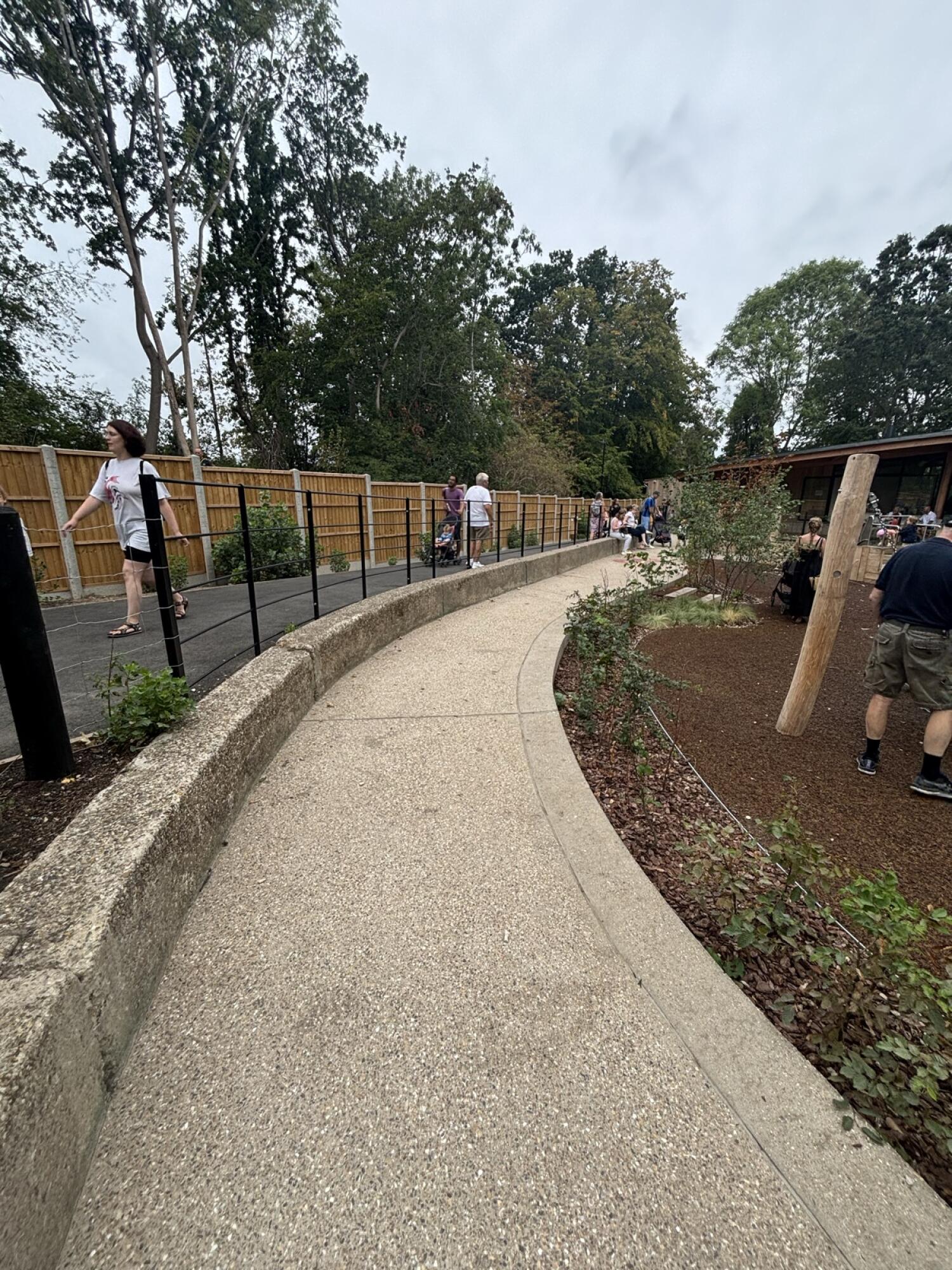 From after opening to steps facing straight. Curved path continues ahead.