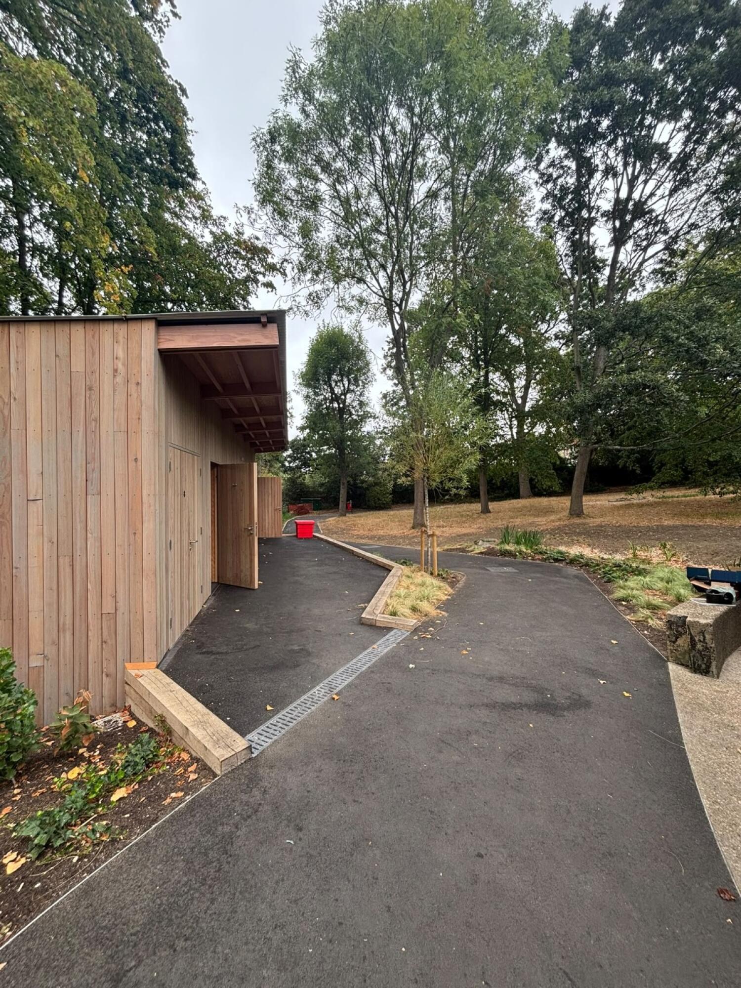 Path curves right, with door on left.