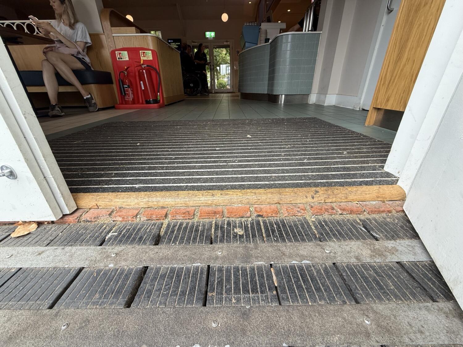 Bump up before door. Doormat after threshold.