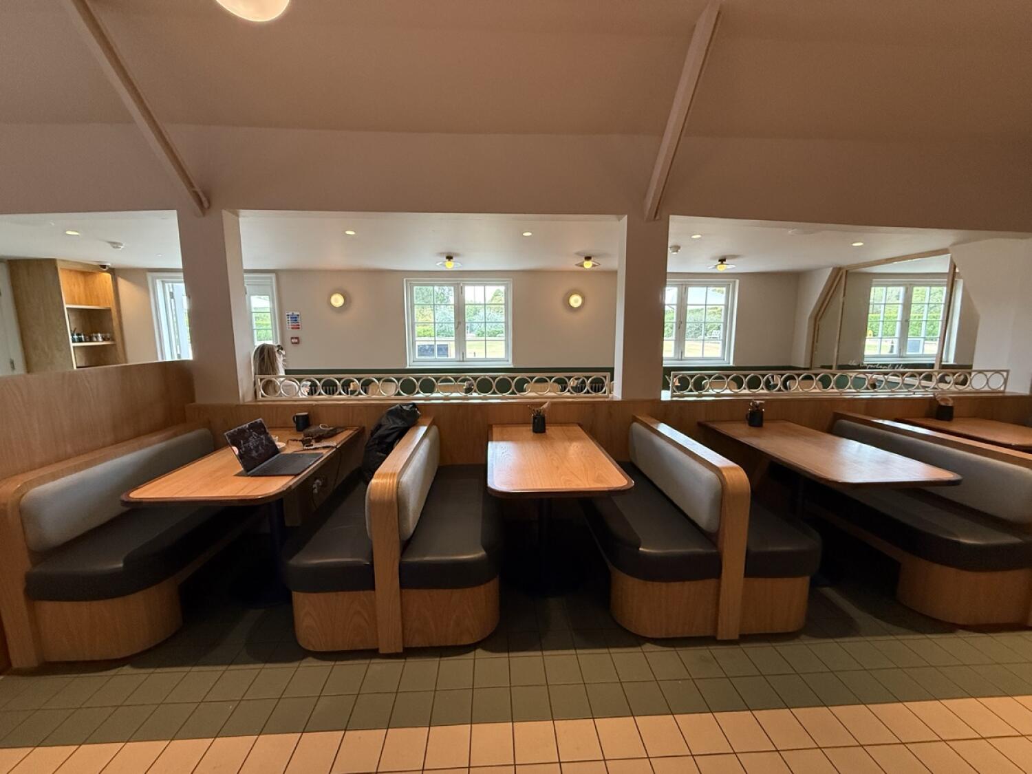 From table facing left. Booths across centre.