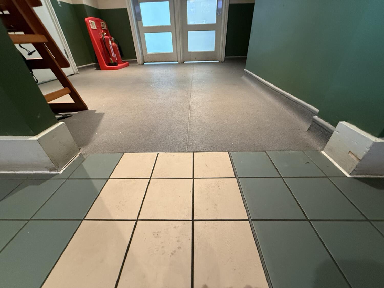 Change of flooring at threshold.