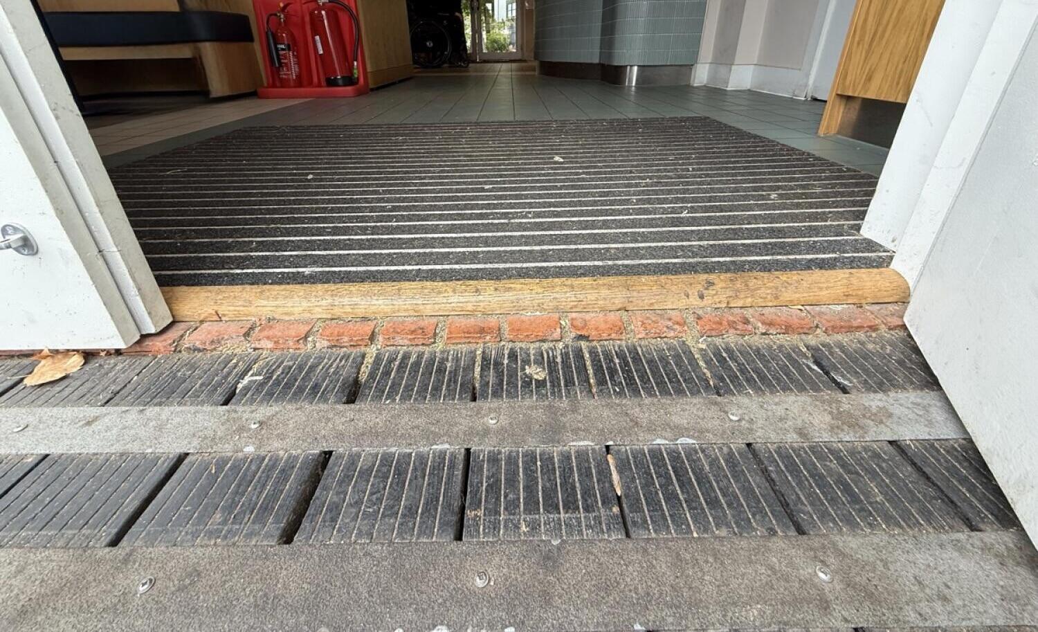 Bump up before door. Doormat after threshold.