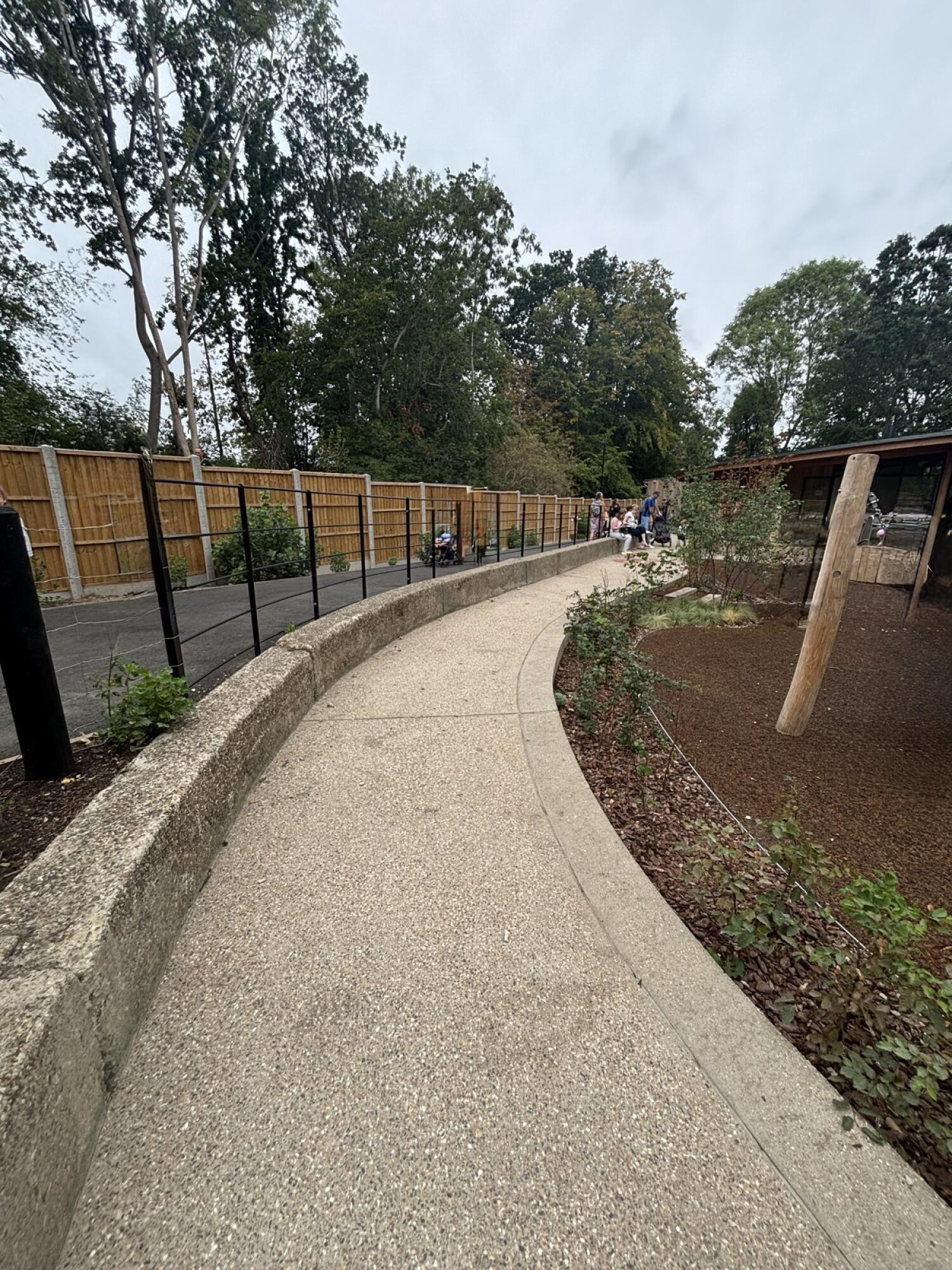 From after opening to steps facing straight. Curved path continues ahead.
