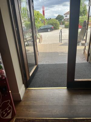 Wood-framed glass doors. Use handles to open.