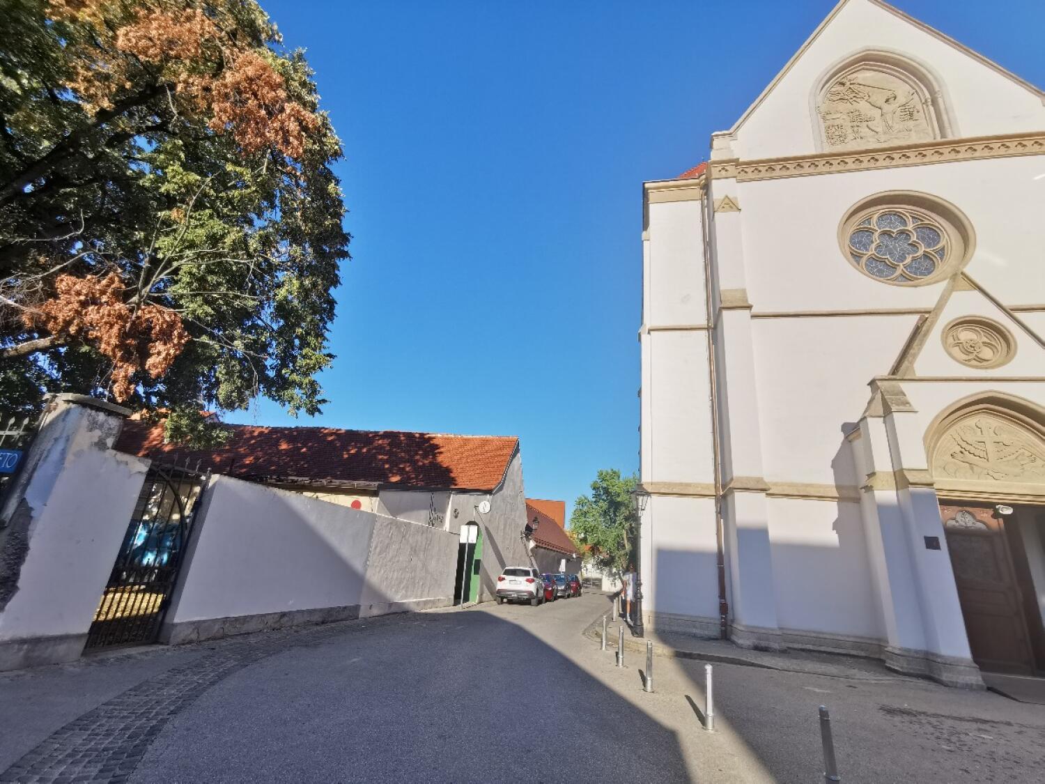 Street path ahead, entrance on right.