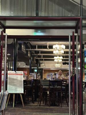 Red metal-framed glass doors. Use handles to open.