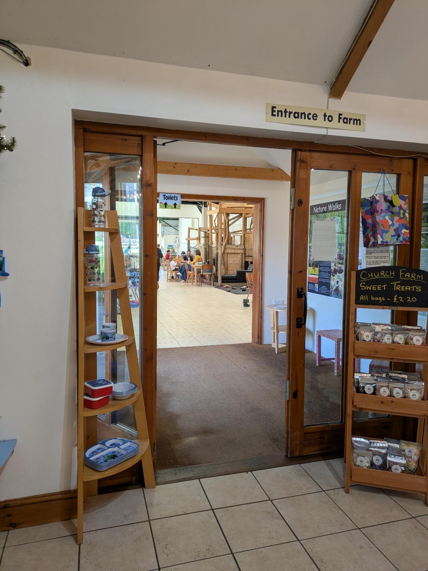 Wood-framed glass doors. Use handles to open.