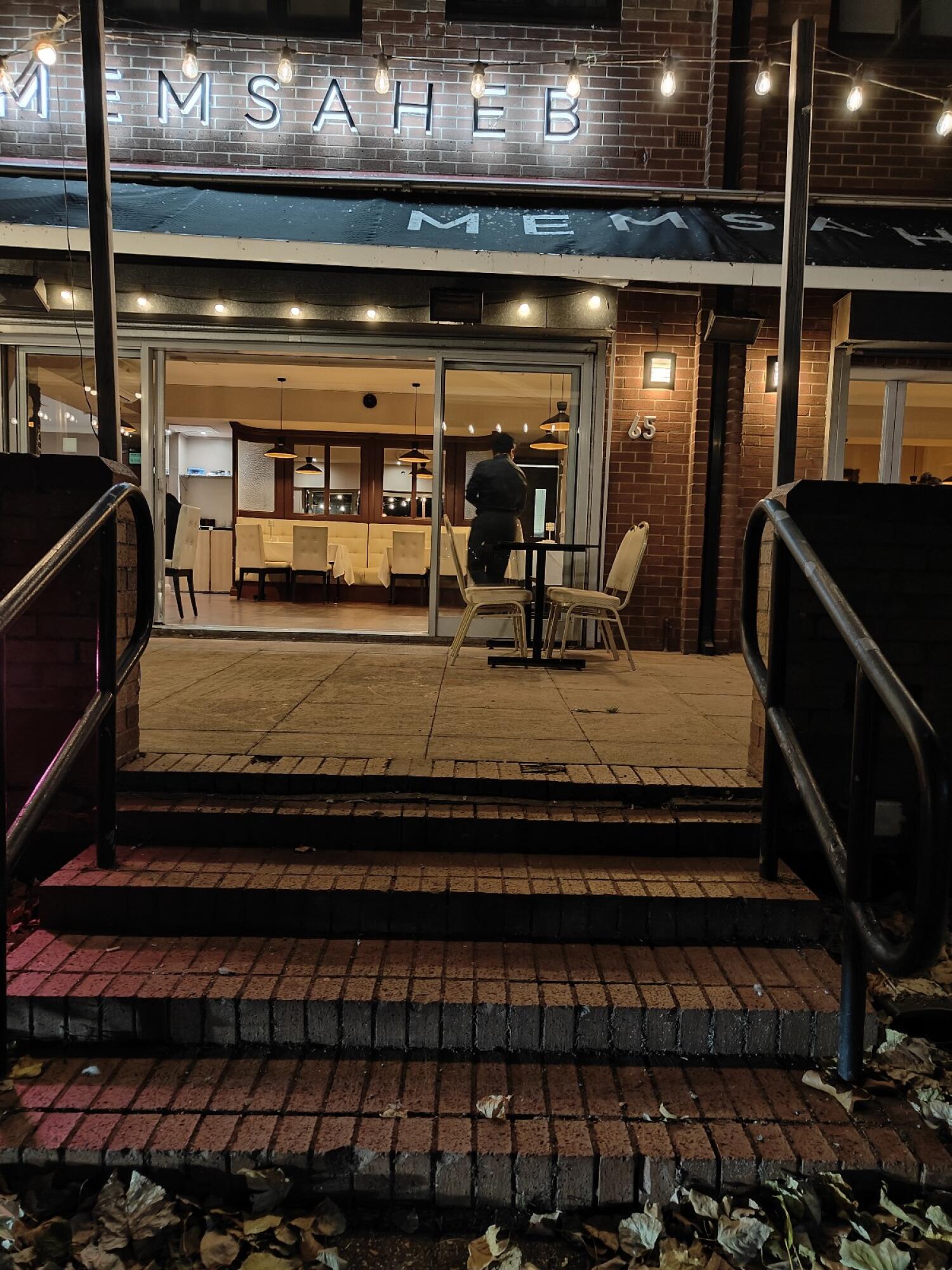 Staircase ahead. Handrails along left and right.