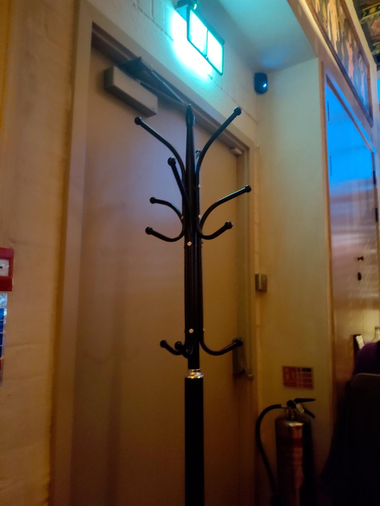 Beige wooden door. Door closer above.