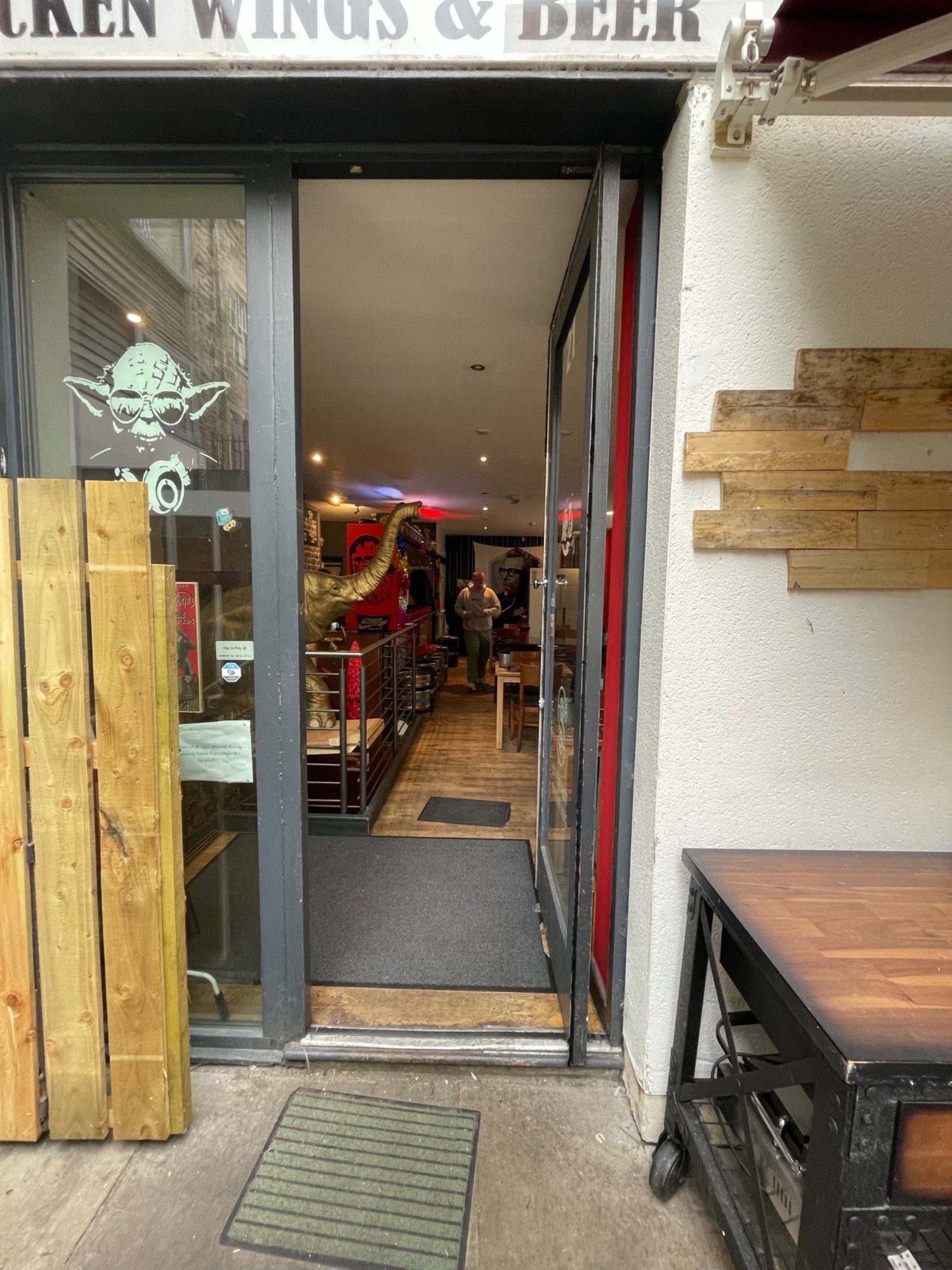 From the door, looking right. Black glass door straight ahead. Handle at left, push to open.