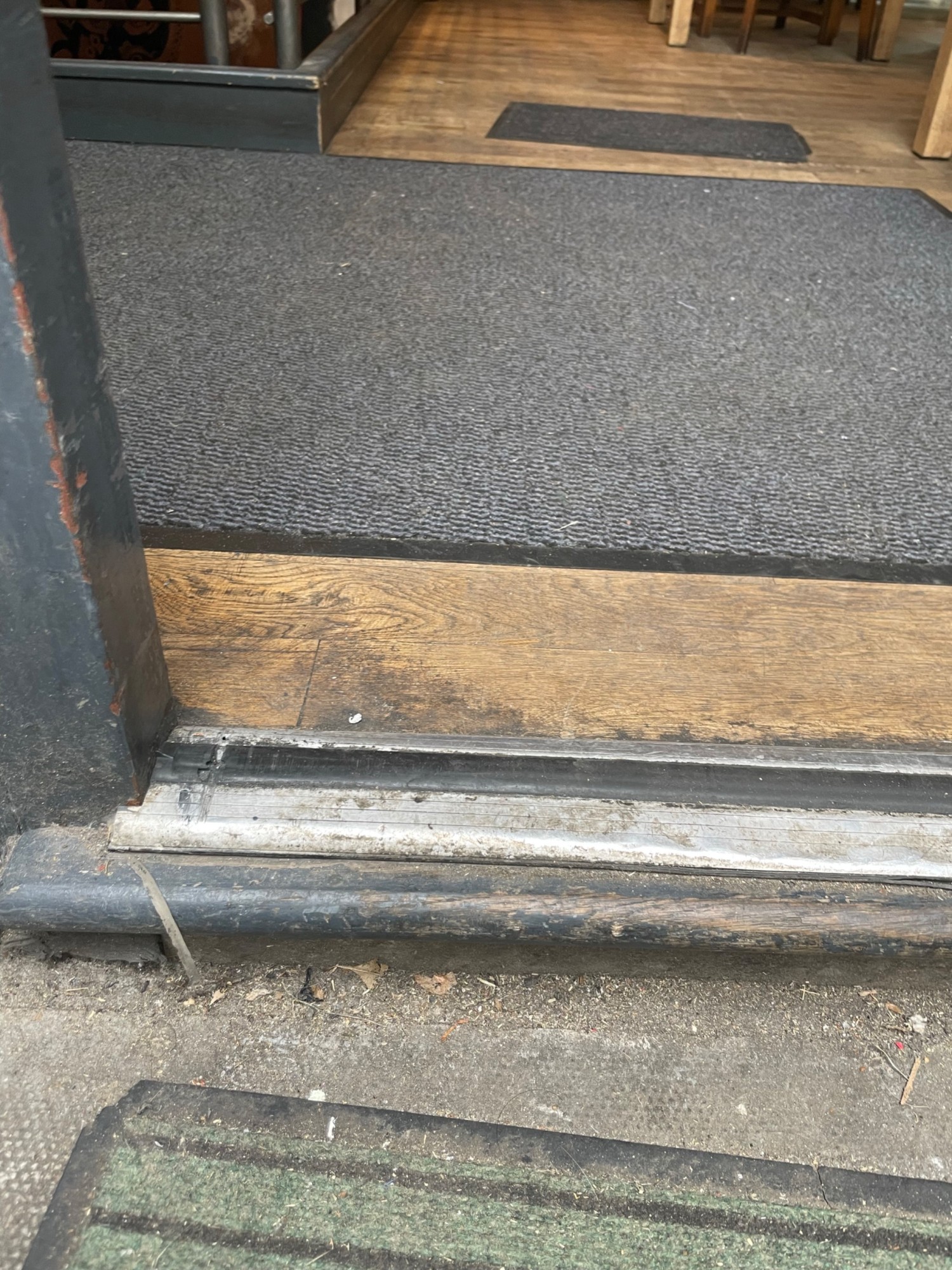 Small step at the entrance door to main seating area.