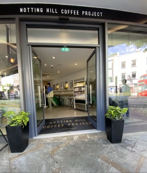 Glass doors with grey frames ahead.