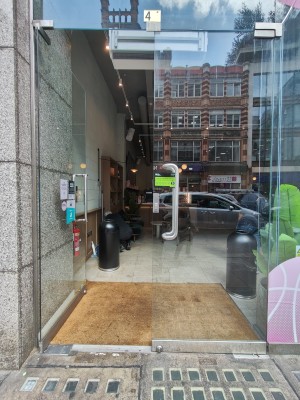 Glass doors. Push silver handles in centre to open.