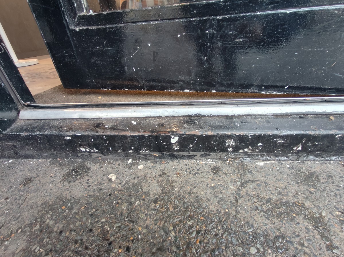 Step up on threshold of door.