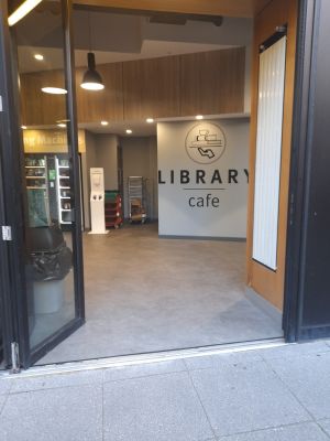 This photo shows an open entrance to the cafe. However, it is not the only entrance to the cafe as the is another entrance with manual doors.