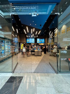 Glass doors ahead. Push silver handles in centre.