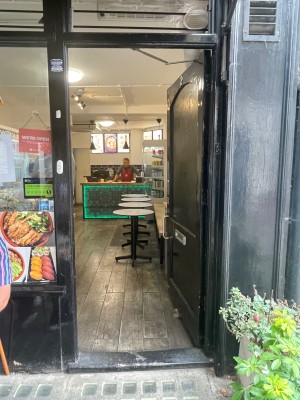 Black door. Push door open from the left.