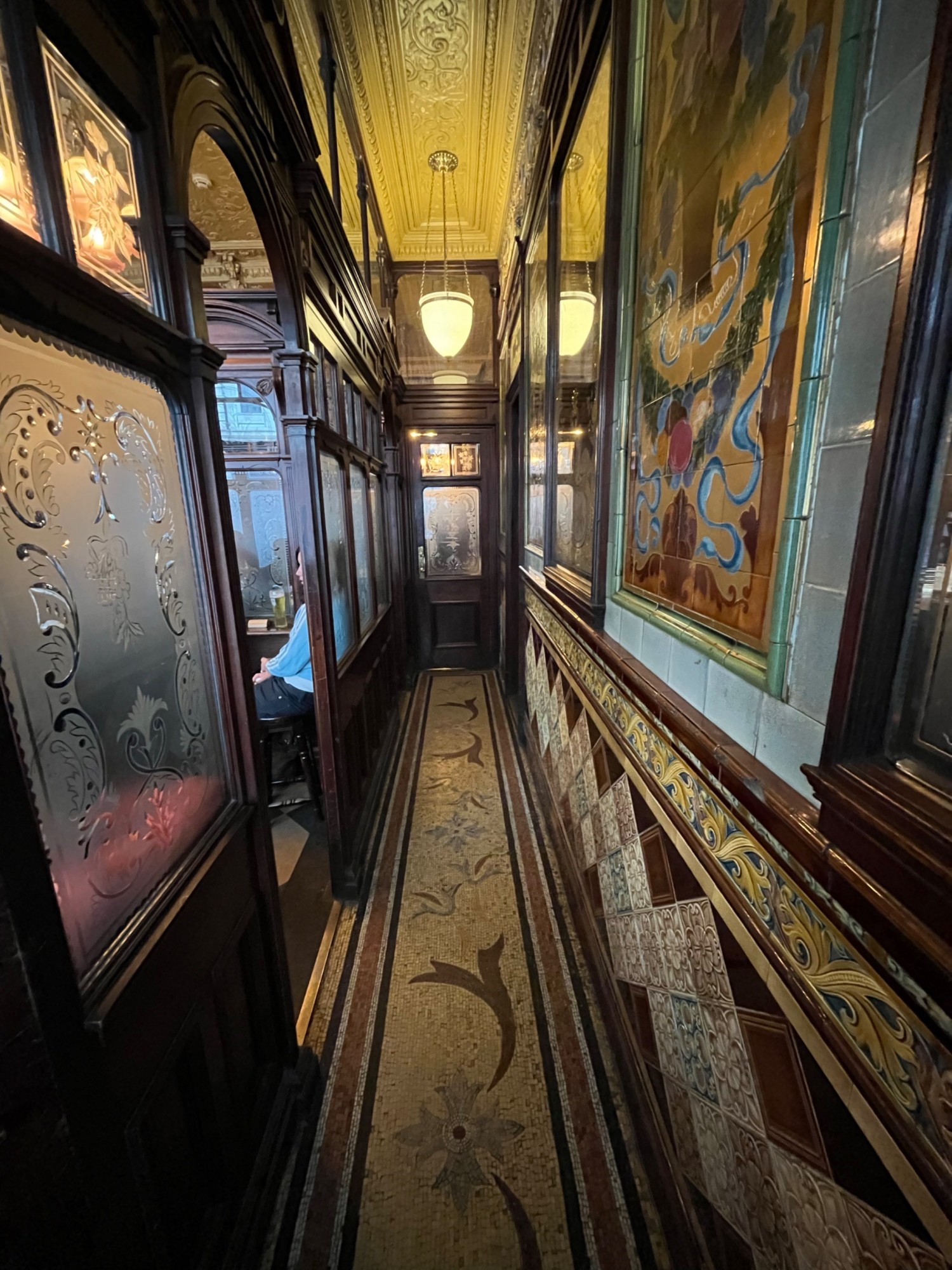 From door facing straight. Path ahead. Open archway on left leads to small room.