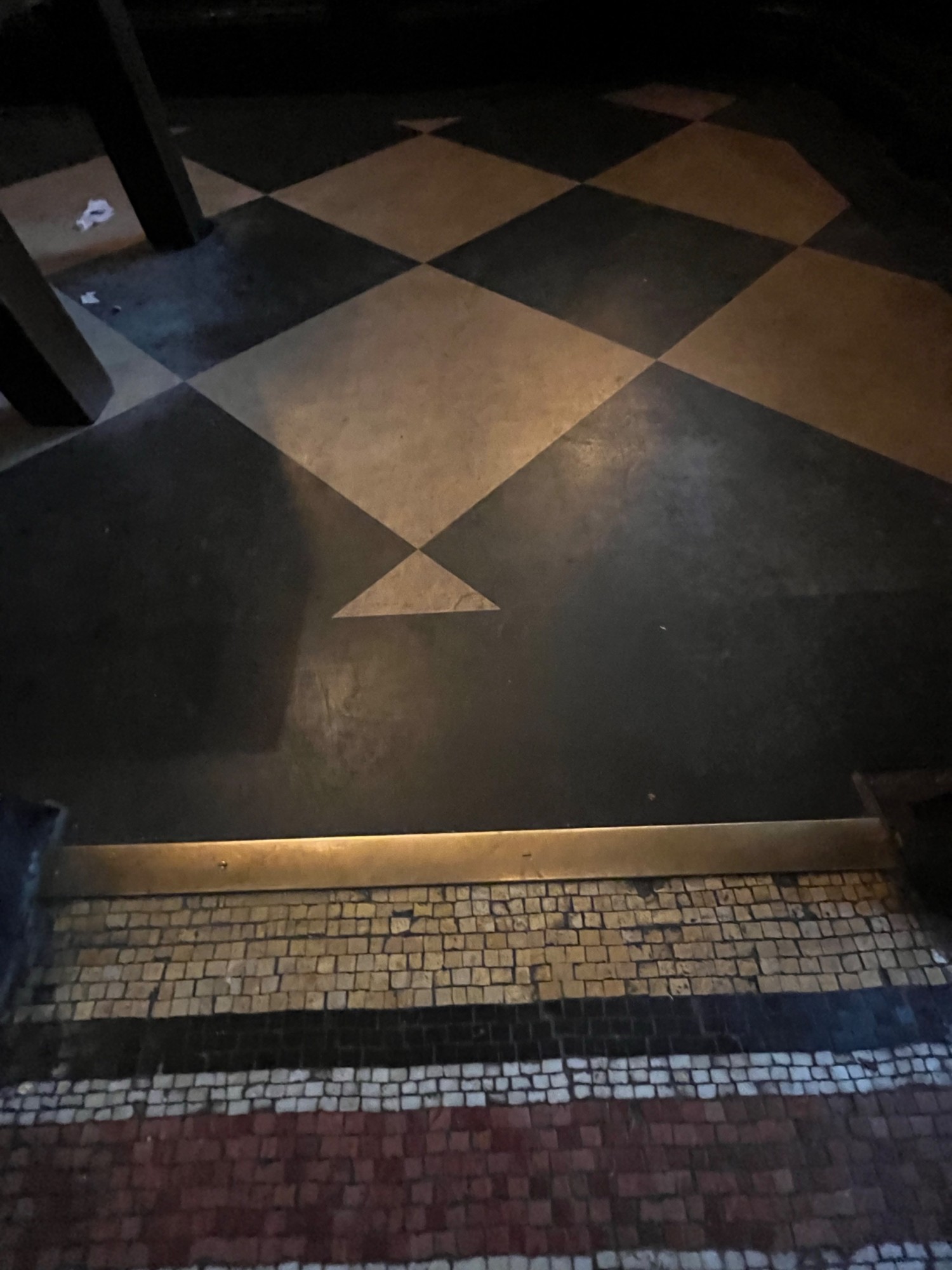 Small bump on threshold of archway.