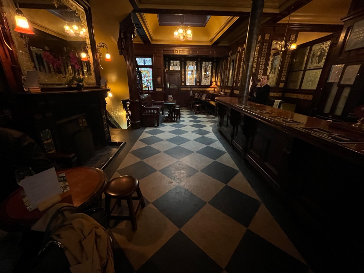 From door facing left. Stool and low table on left. Spacious path ahead.