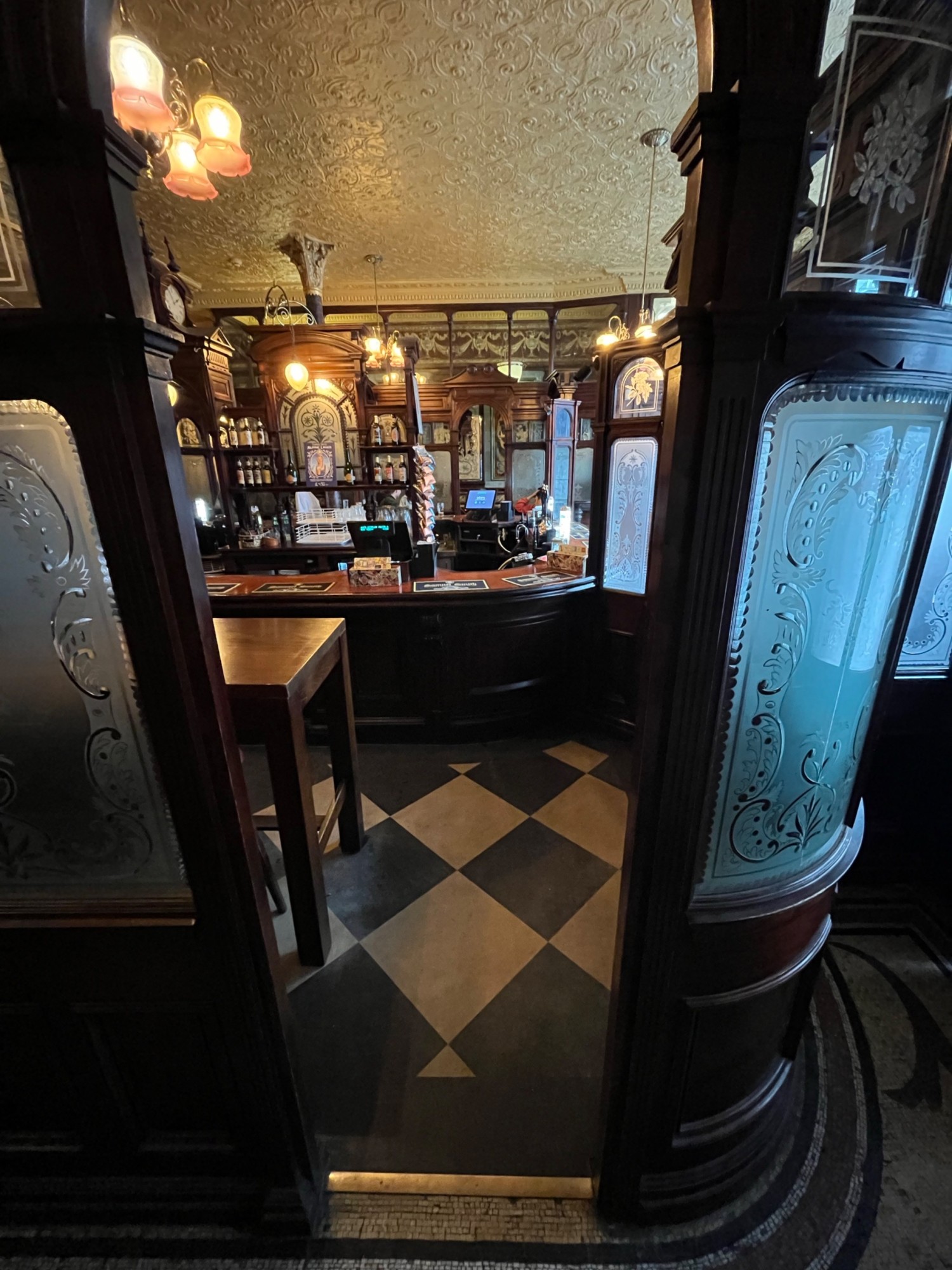 From door facing right. Open archway ahead.