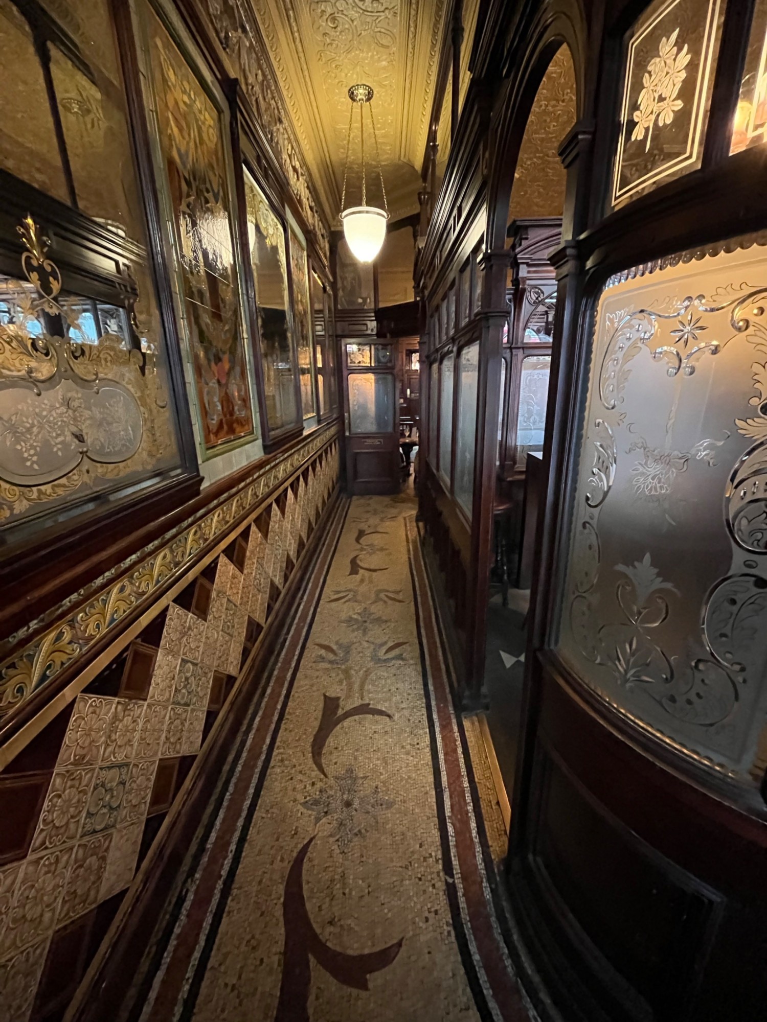 From doors facing straight. Path ahead, open archway on right wall.